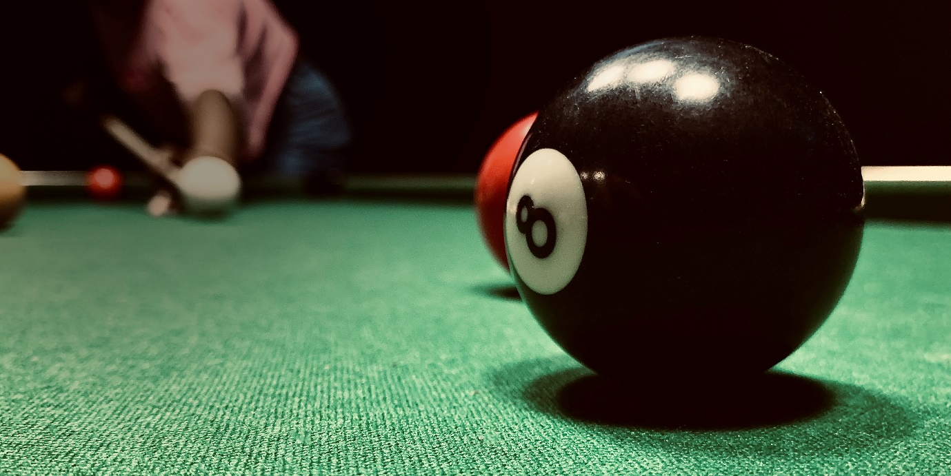 Player aiming for the 8 ball.