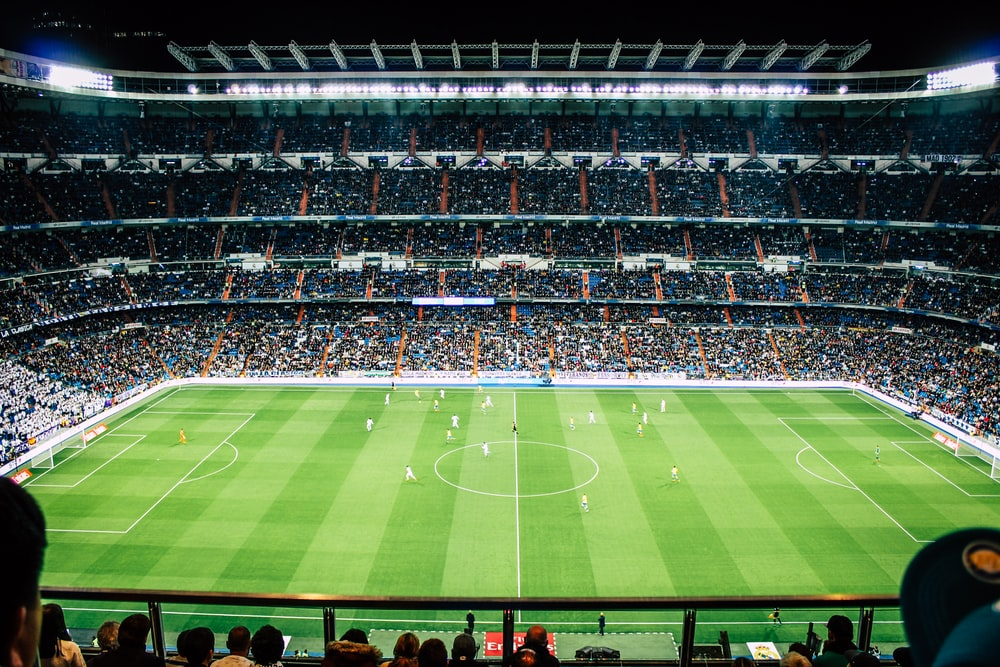Football players playing a match at a stadium in Madrid