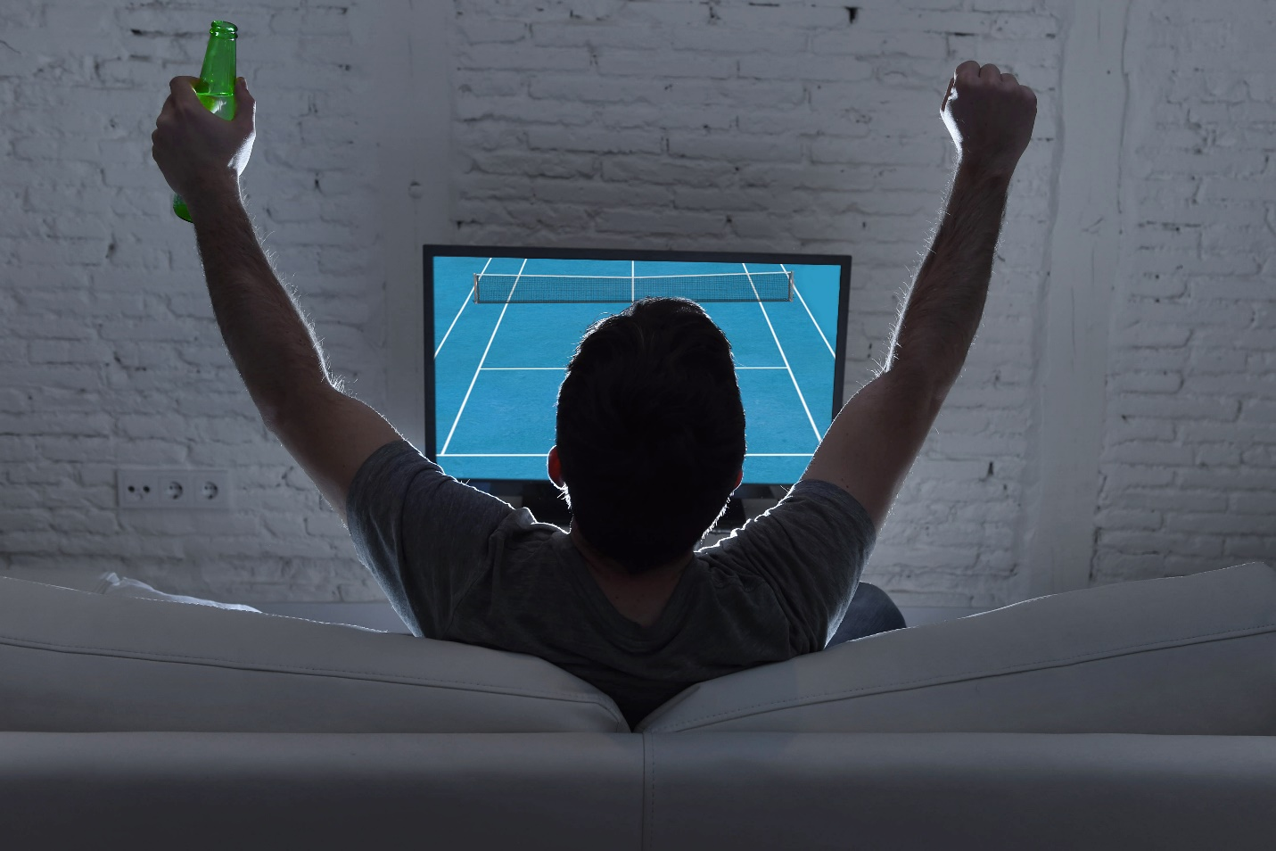 a man watching tennis