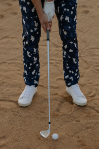 A golf club and ball