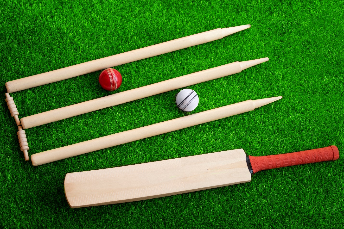 Cricket bat, ball, and stumps