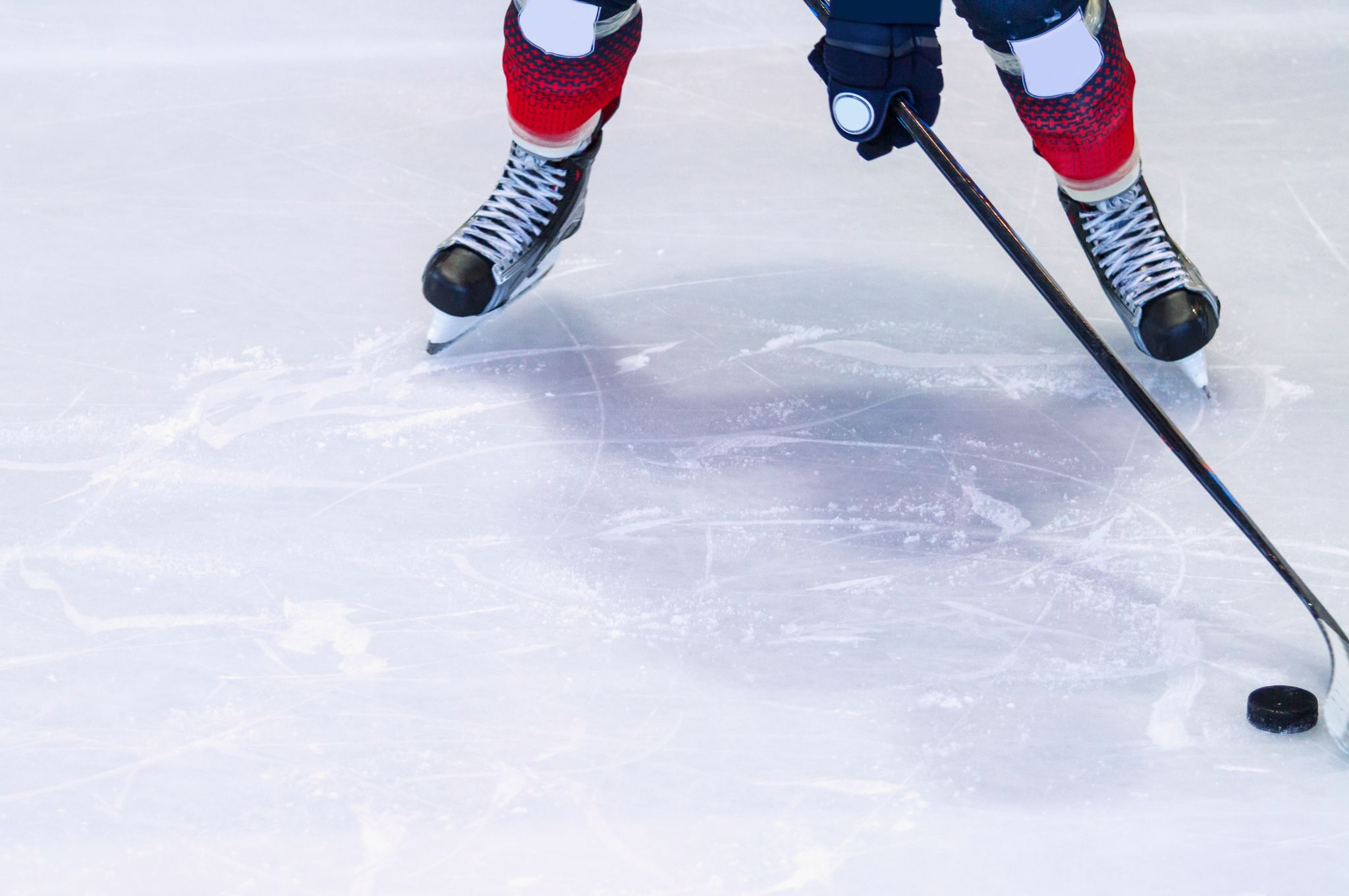 An ice hockey player on an ice rink