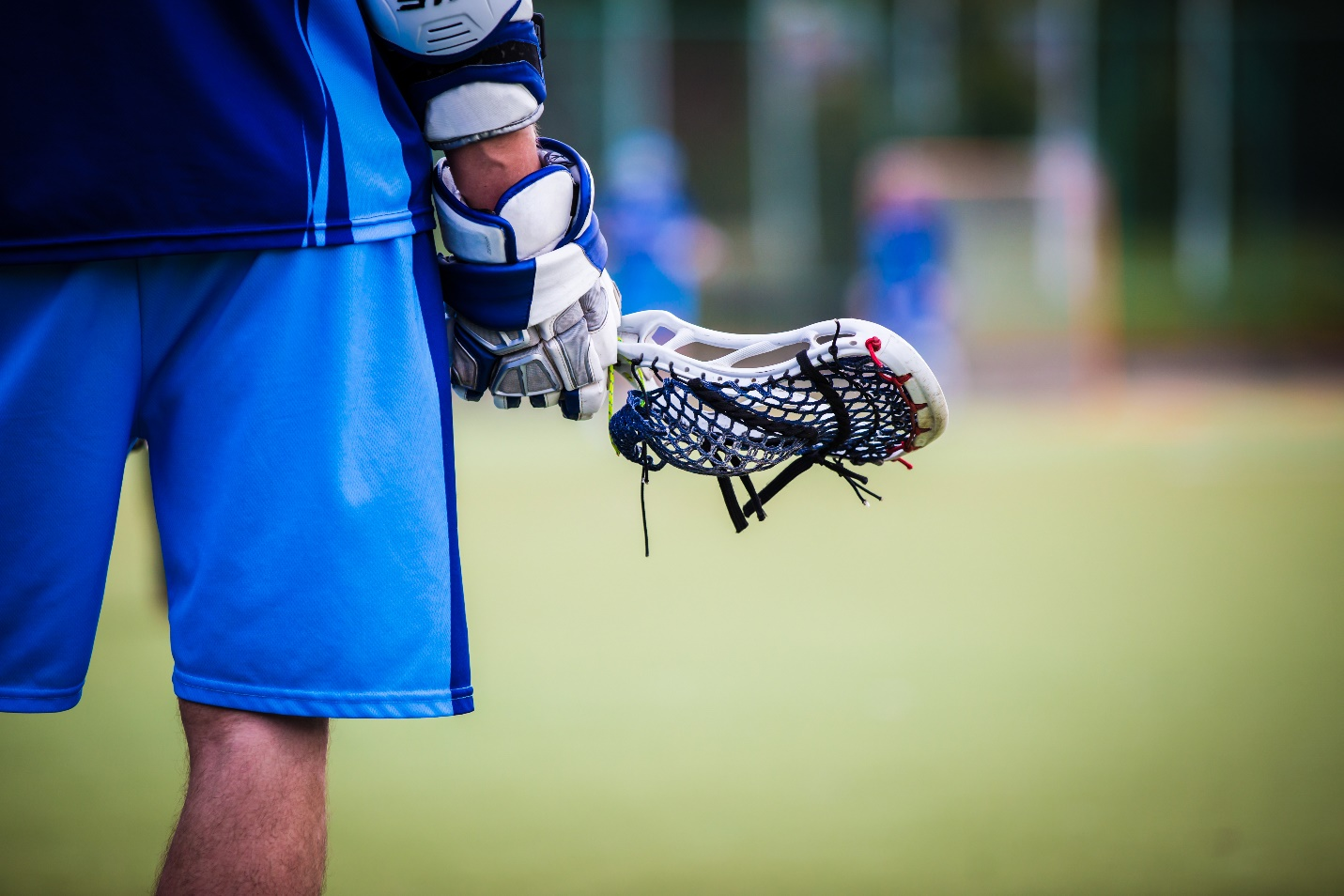 A lacrosse player holding a lacrosse stick