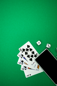 a smartphone placed on playing cards