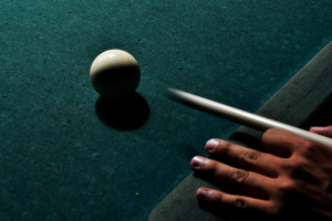 A stick about to strike the ball.