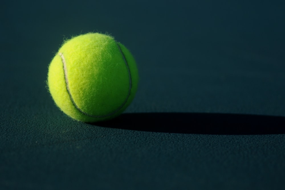 A tennis ball on the floor