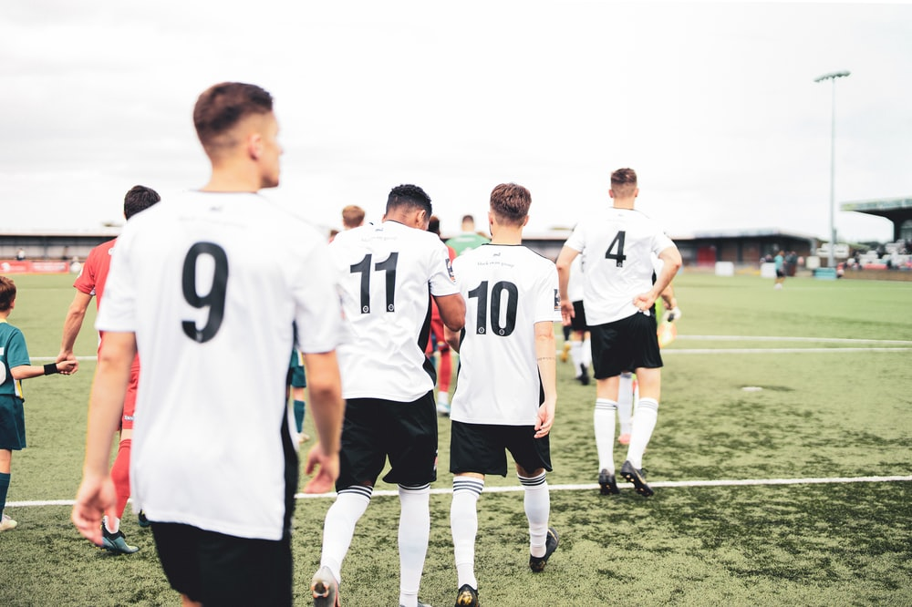 Players entering a football field