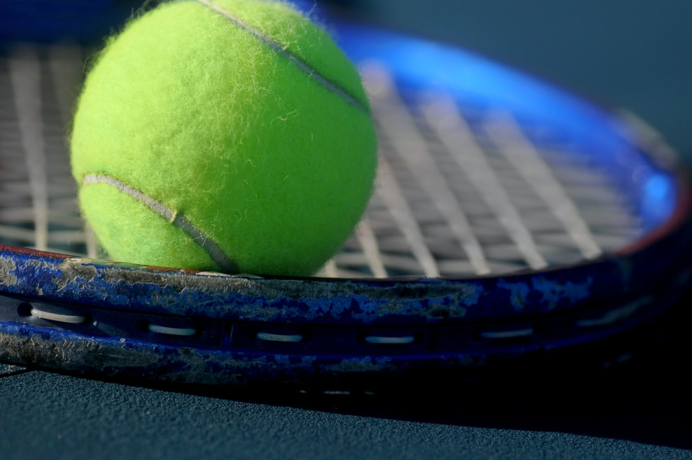 A tennis racket and a ball