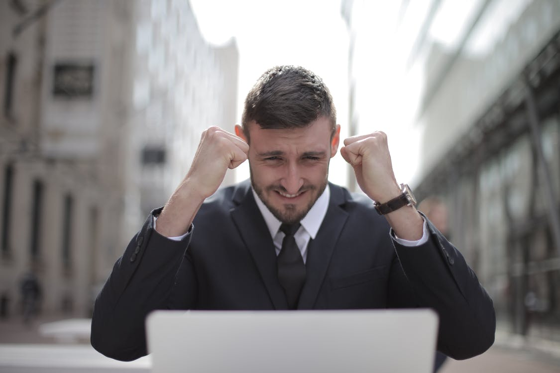 A man cheering after winning a bet