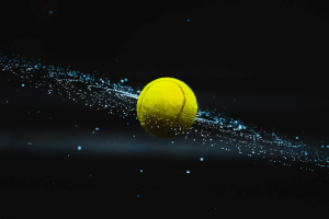 A tennis ball spinning in midair.