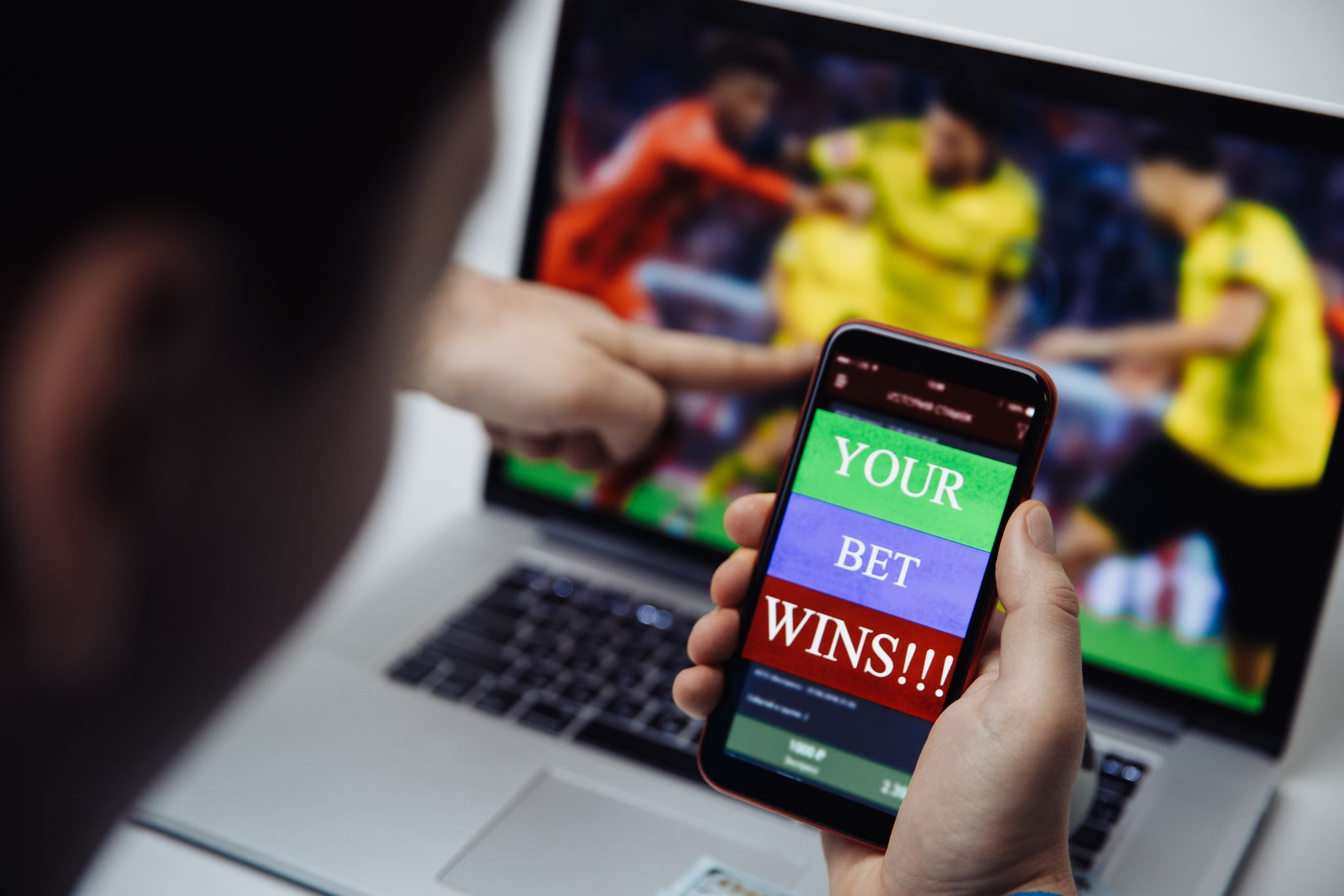 A man betting through online sports betting app