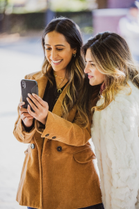 women placing a bet on a betting site in the UK