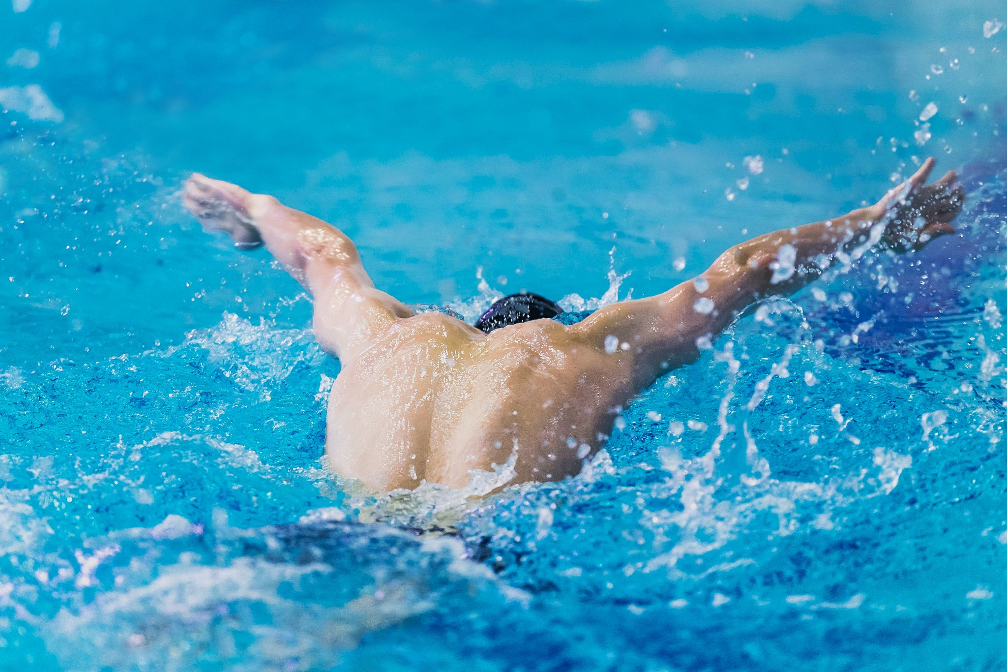 a swimmer doing butterfly style swimming