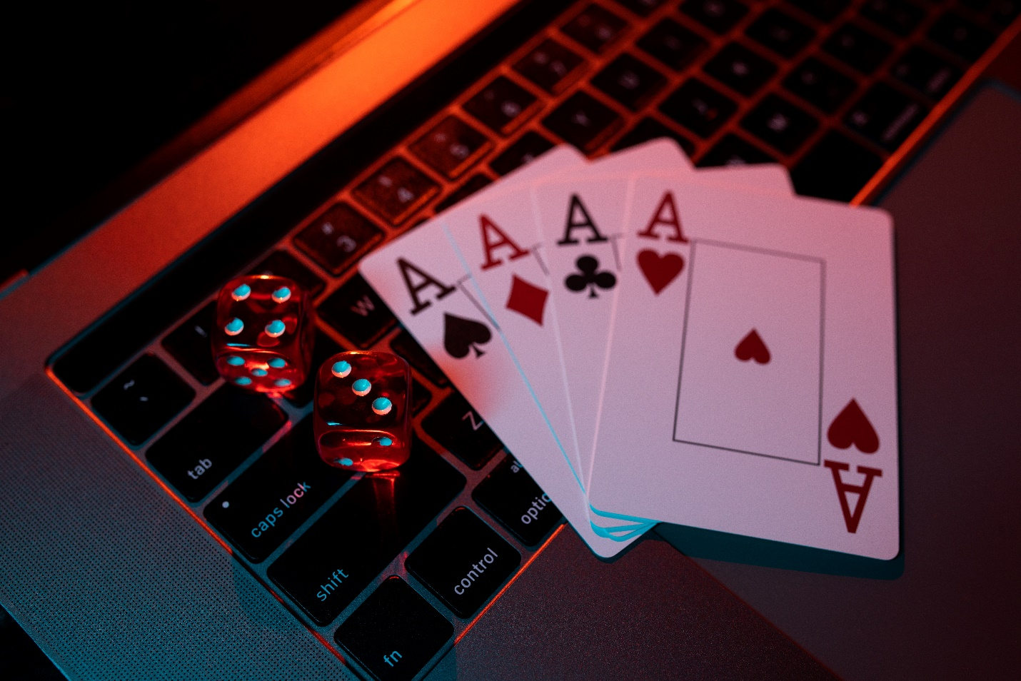 Cards and dice on a laptop