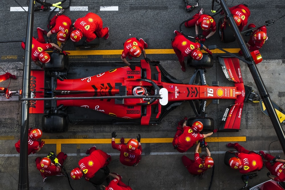 The Formula One Ferrari team during a pit stop
