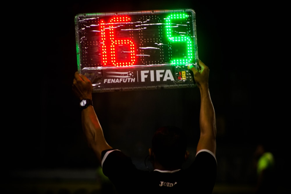  A referee holding a substitute board