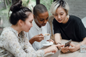 Friends smiling at a phone