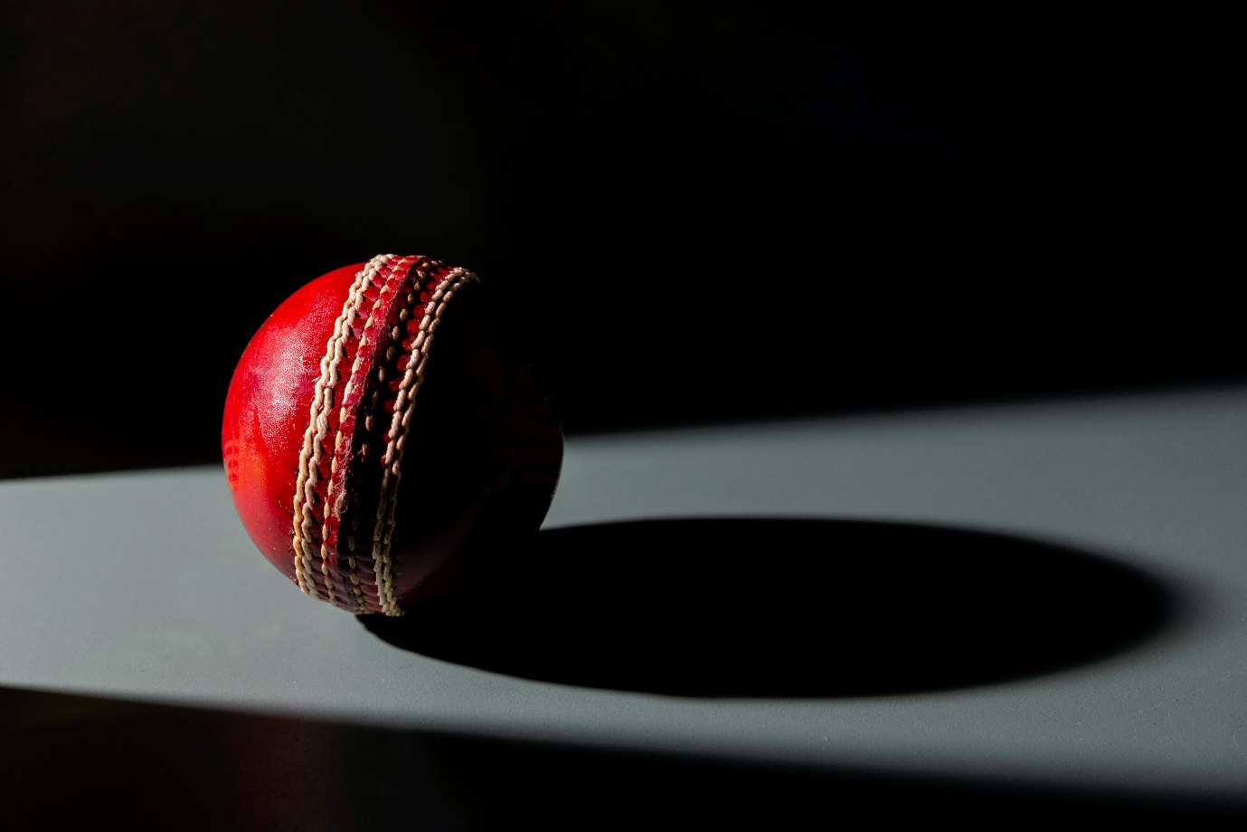 a red cricket ball