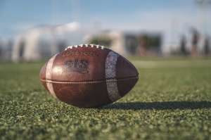 An American football on the ground