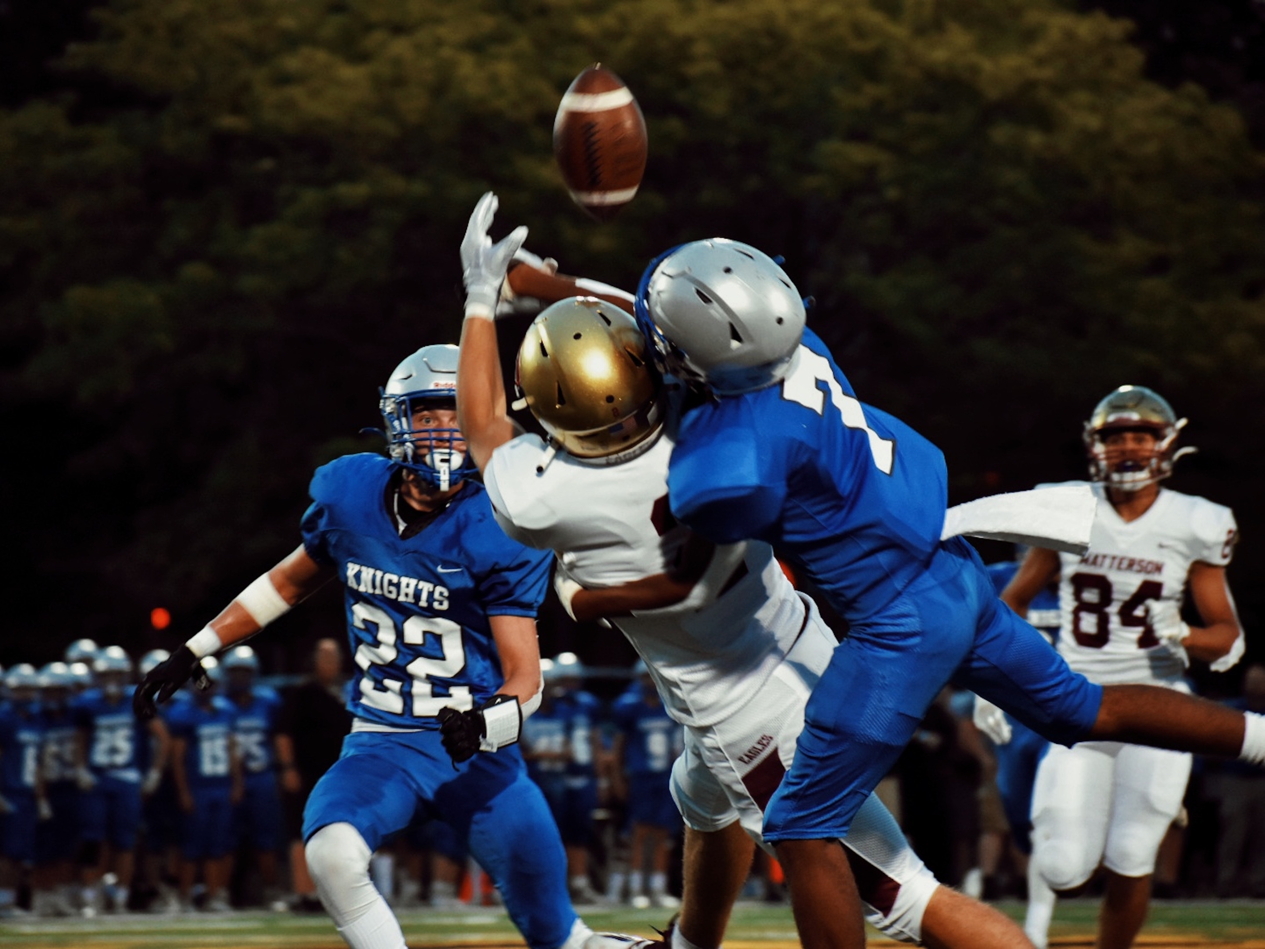 Football players tussling for the ball