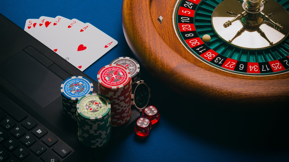 Poker chips, cards, and roulette