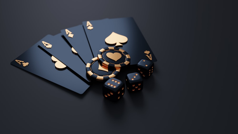 Black and gold cards, dice, and chips