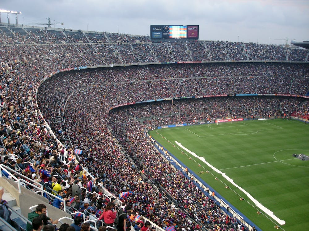 spectators enjoying football match at a stadium