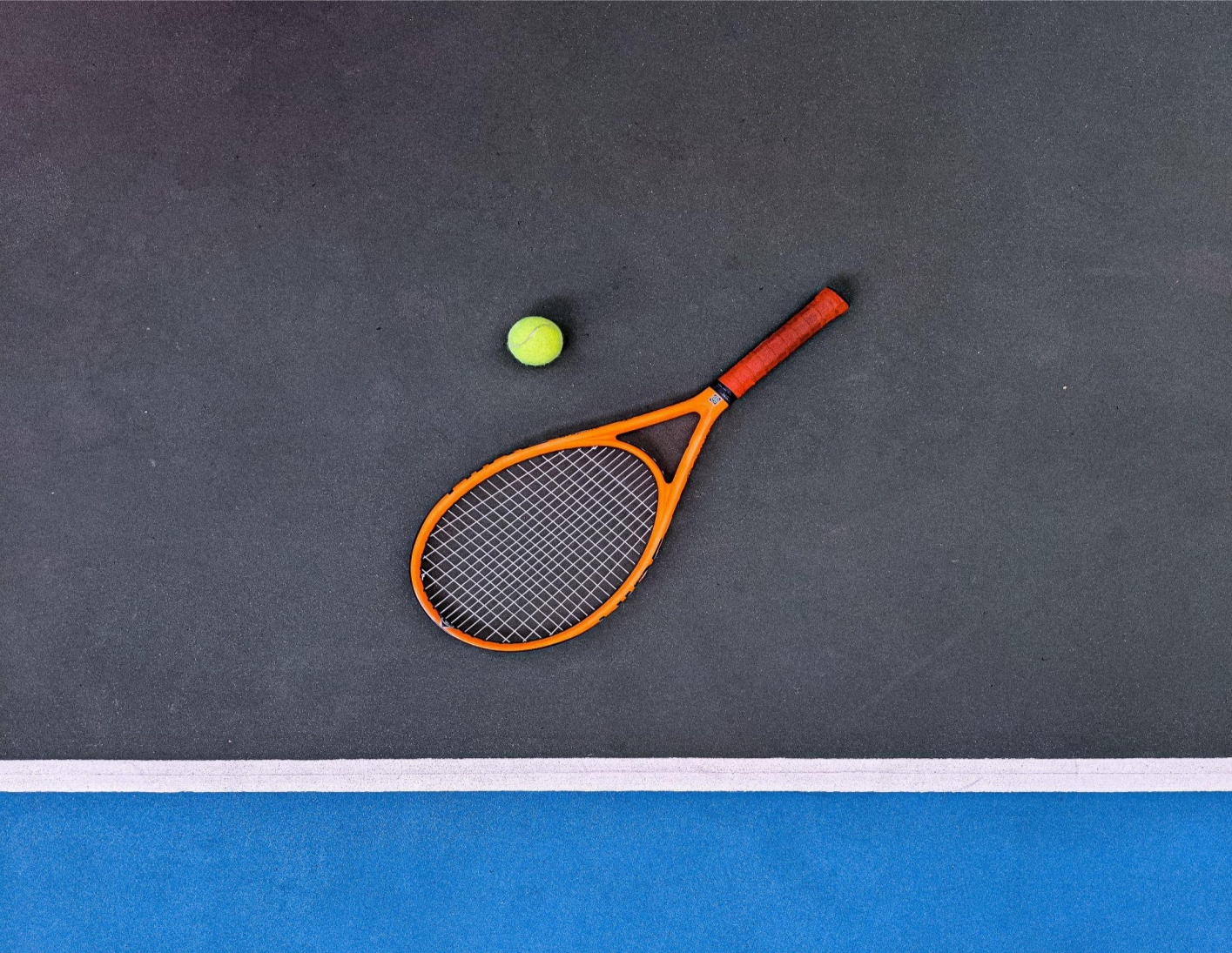  Tennis racquet and ball in a court