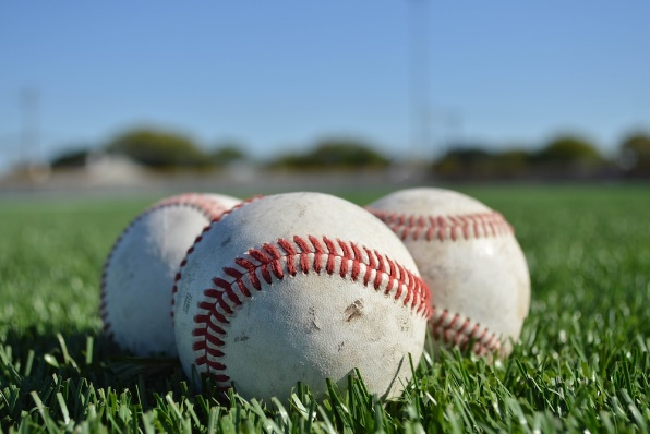 Baseballs on grassy surface