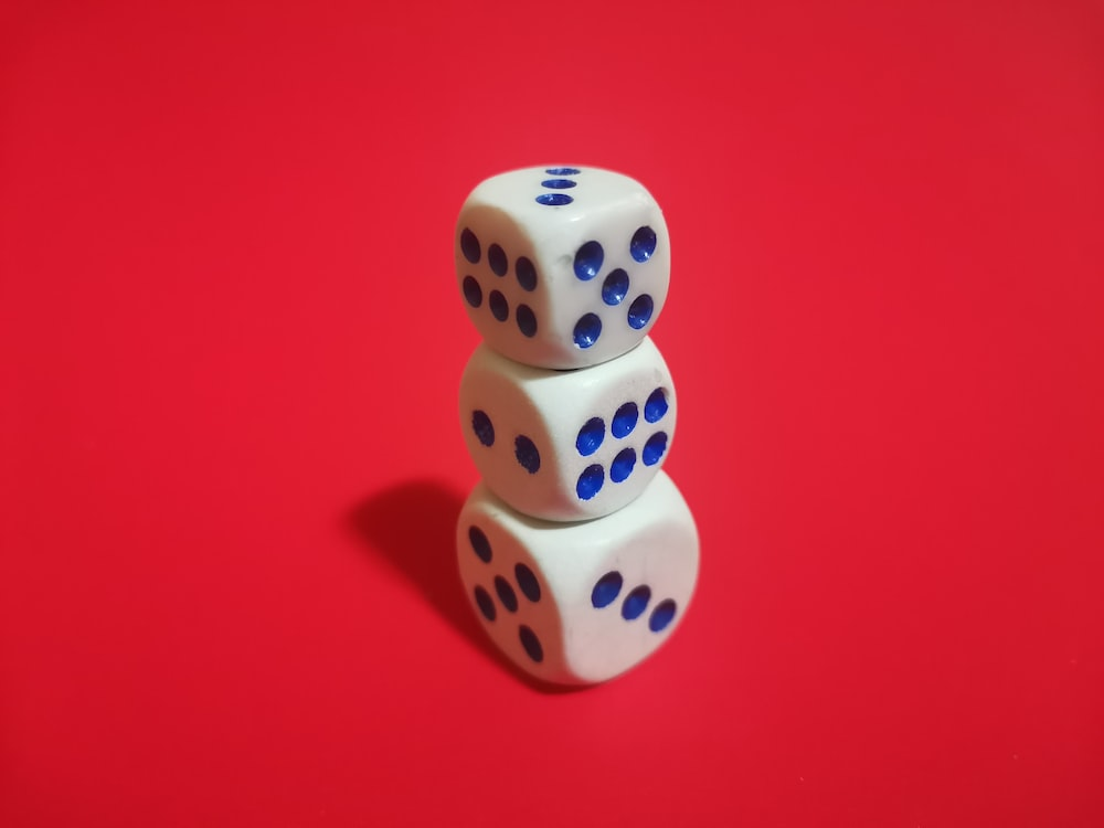 Three dice stacked with red background