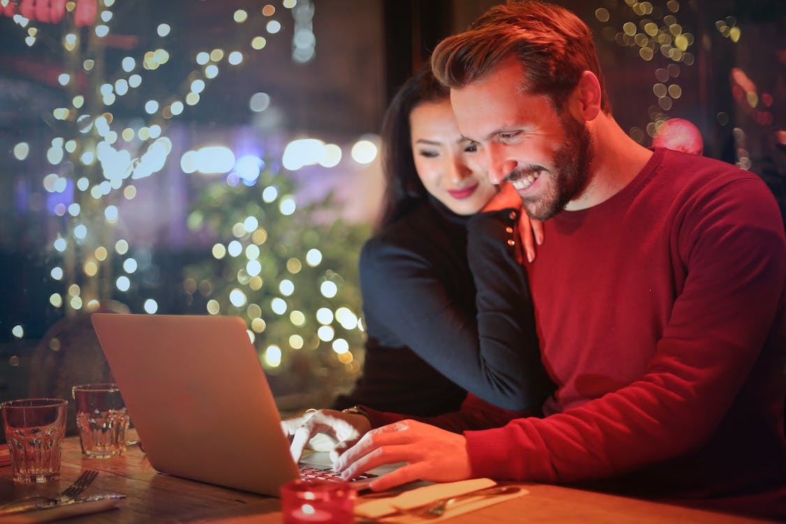 A couple enjoying an online casino on Christmas eve