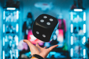 A person catching a dice