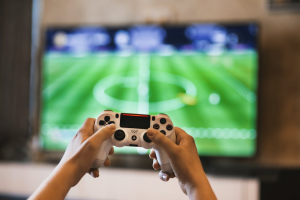 A person holding a console