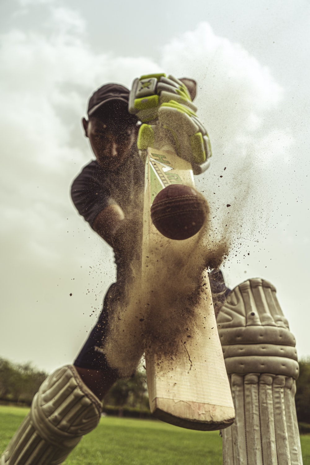 An athlete playing cricket