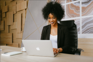 A woman using a computer in her office