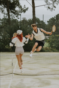 Tennis doubles pair celebrating